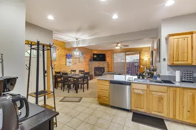 a kitchen and living room with a dining room at Patio and Mountain Views Central Grand Lake Condo! in Grand Lake