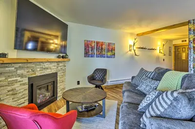 a living room with a couch and a fireplace at MtnandLake Views and 3 Mi to Skiing Dillon Condo in Dillon