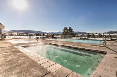 a swimming pool in the middle of a yard at Walk to Winter Park Bus From Fraser Condo! in Fraser