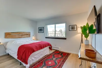 a bedroom with a bed and a window at Walk to Winter Park Bus From Fraser Condo! in Fraser