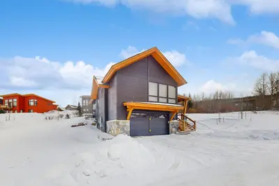 a house in the snow with snow around it at A Slice of Silverthorne in Silverthorne