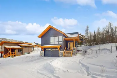 a house in the snow with snow covered ground at A Slice of Silverthorne in Silverthorne