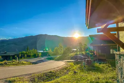 a car parked on a road next to a house at A Slice of Silverthorne in Silverthorne
