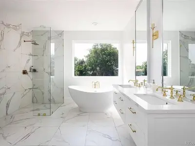 a white bathroom with a tub and a glass shower at New! Pure Luxury W Private Pool/Spa & Game Center! in Arvada