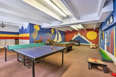 a play room with a ping pong table and colorful walls at 6 Mi to Keystone Resort Cozy Lake Dillon Condo! in Dillon