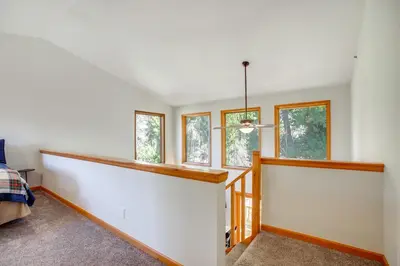 a room with white walls and windows at Steps to Grand Lake New Deck at The Innlet Condo in Grand Lake