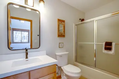 a bathroom with a toilet and a sink and a shower at Steps to Grand Lake New Deck at The Innlet Condo in Grand Lake