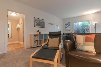 a living room with a leather couch and a chair at Galena Getaway: Dog-Friendly Frisco Retreat in Frisco