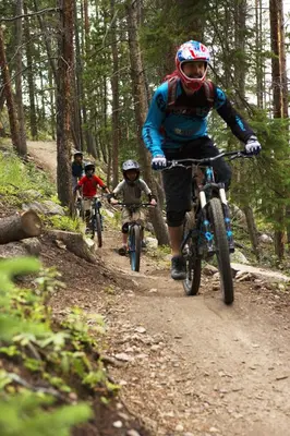 a group of people riding bikes on a dirt trail at Condo on Shuttle Rt-Wild Irishman with Pool and More in Keystone