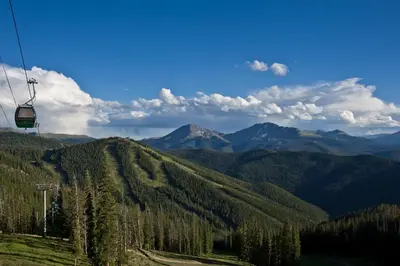 a gondola ride in the mountains with trees at Condo on Shuttle Rt-Wild Irishman with Pool and More in Keystone
