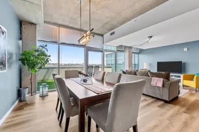 a dining room with a table and a couch at 1700 Bassett, Unit 818 in Denver