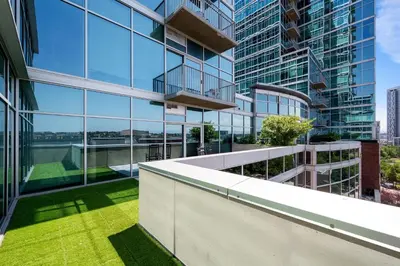 an exterior view of a building with green grass at 1700 Bassett, Unit 818 in Denver