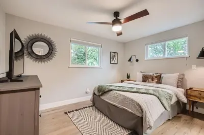 a bedroom with a bed and a ceiling fan at 6636 Depew St (upper) in Arvada