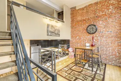 a brick wall with a clock on a wall at 2193 Arapahoe St Unit 17 in Denver