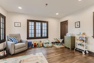 a living room with a chair and a table at 2375 Ivanhoe St - Entire House in Denver