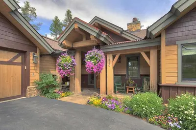 a house with flowers on the front of it at Moose Crossing Lodge in Breckenridge