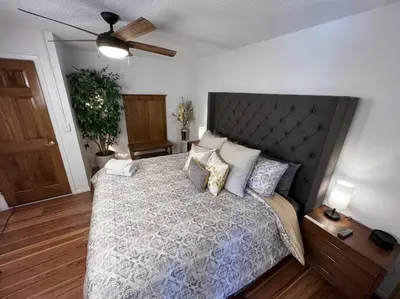 a bedroom with a large bed and a ceiling fan at Spacious, Cal King Bed, Sleeps 6, Full Kitchen in Loveland