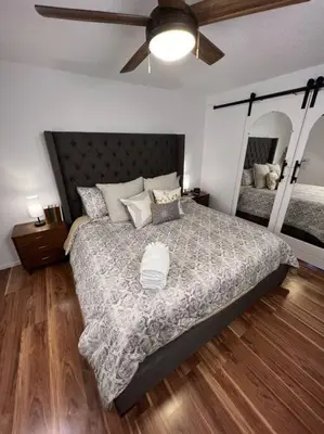 a bedroom with a large bed and a ceiling fan at Spacious, Cal King Bed, Sleeps 6, Full Kitchen in Loveland