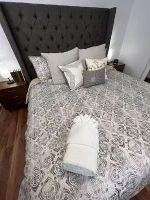 a bedroom with a large bed with a black headboard at Spacious, Cal King Bed, Sleeps 6, Full Kitchen in Loveland