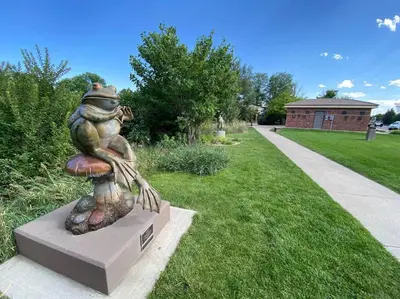 a statue of a toad sitting on a mushroom at Spacious, Cal King Bed, Sleeps 6, Full Kitchen in Loveland