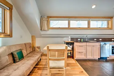 a living room with a couch and a table at Updated Boulder Studio about 1 Mi to Pearl Street in Boulder