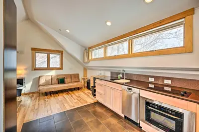 an open kitchen with a couch in the background at Updated Boulder Studio about 1 Mi to Pearl Street in Boulder