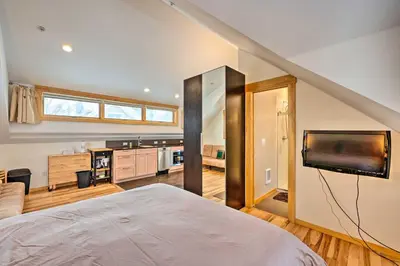 a bedroom with a bed and a tv in a room at Updated Boulder Studio about 1 Mi to Pearl Street in Boulder