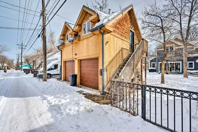 a house with a fence in the snow at Updated Boulder Studio about 1 Mi to Pearl Street in Boulder