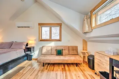 a bedroom with a couch and a bed and a window at Updated Boulder Studio about 1 Mi to Pearl Street in Boulder