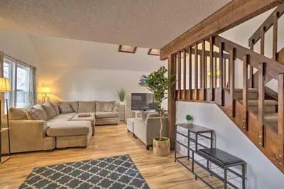 a living room with a couch and a table at Family-Friendly Aurora Vacation Rental with Yard! in Aurora