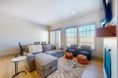 a living room with a couch and a table at Eagle Ridge Retreat in Granby