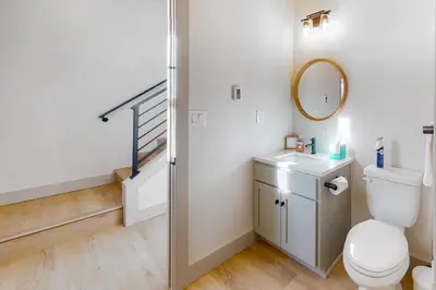 a bathroom with a toilet and a staircase at Eagle Ridge Retreat in Granby