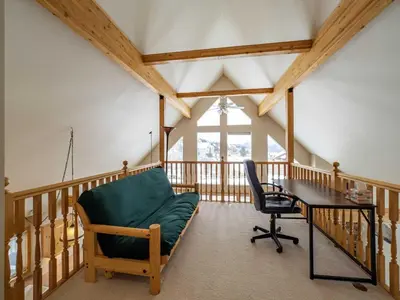 an office with a desk and a chair and a table at Overlook, 0015 in Granby