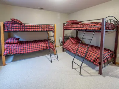 a room with two bunk beds in it at Overlook, 0015 in Granby