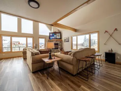 a living room with two couches and a table at Overlook, 0015 in Granby