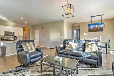 a living room with a couch and chairs and a table at 10 Mi to DIA Spacious Aurora House with Yard! in Aurora