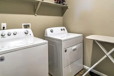 a small laundry room with a washer and dryer at 10 Mi to DIA Spacious Aurora House with Yard! in Aurora
