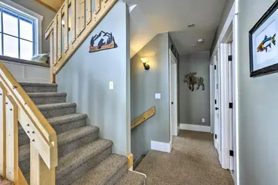 a staircase in a home with a stair case at Granby Home Stunning Mountain and Lake Views! in Granby