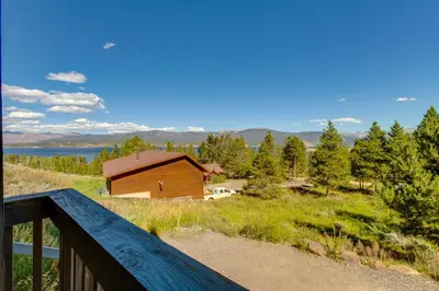 a view of a cabin from the deck of a house at Granby Home Stunning Mountain and Lake Views! in Granby