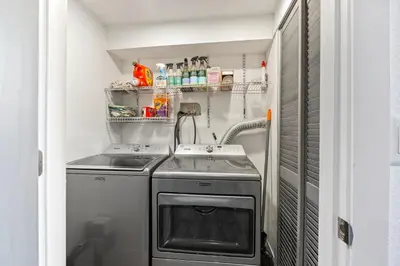 a small kitchen with a stove and a sink at Basement with Full Kitchen and Near Downtown in Denver