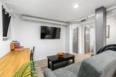 a living room with a couch and a table at Basement with Full Kitchen and Near Downtown in Denver
