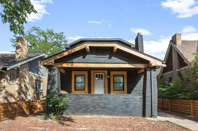 a home with a black house with a roof at Basement with Full Kitchen and Near Downtown in Denver