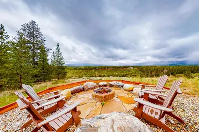 two chairs and a fire pit on a patio at Tabernash Tranquility in Tabernash