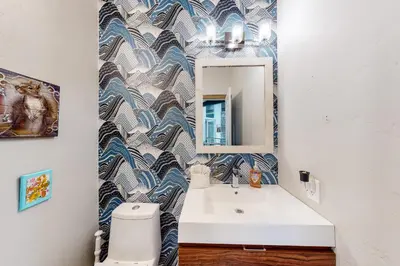 a bathroom with a sink and a mirror at Tabernash Tranquility in Tabernash