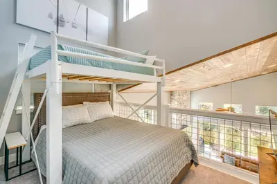 a bedroom with a bunk bed with a ladder at 6 Mi to Winter Park Resort Home with Free Shuttle in Winter Park