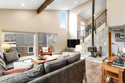 a living room with a couch and a fireplace at Mount Royal in Frisco