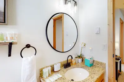 a bathroom with a sink and a mirror at Grand Lake Lookout in Grand Lake