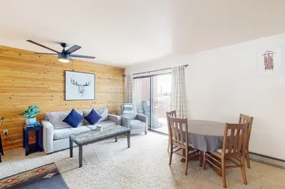 a living room with a couch and a table at Grand Lake Lookout in Grand Lake