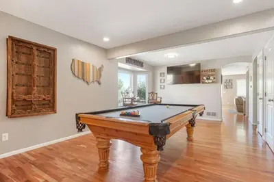 a living room with a pool table in it at Sleeps 12 - Thornton - 25 Min to Downtown Denver in Thornton