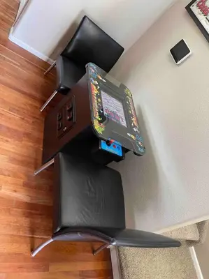 a computer monitor on top of a chair in a room at Sleeps 12 - Thornton - 25 Min to Downtown Denver in Thornton